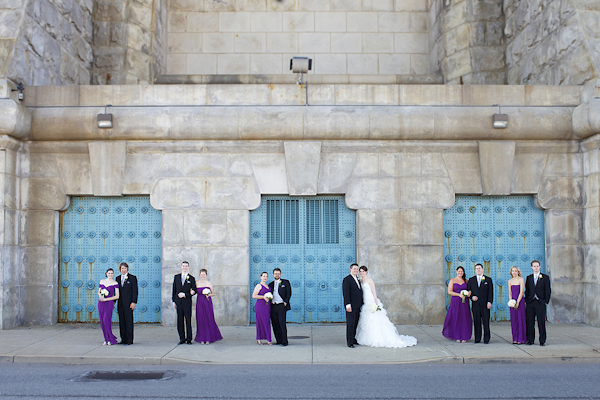 bride and groom pose with wedding party - purple bridesmaid dresses - wedding photo by top Philadelphia based wedding photographers Langdon Photography